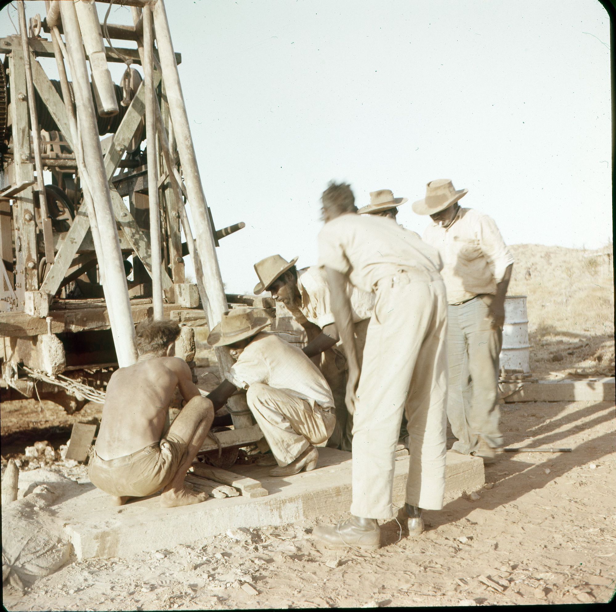Men working on a drilling plant
